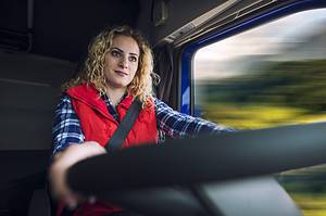 woman driving truck vehicle