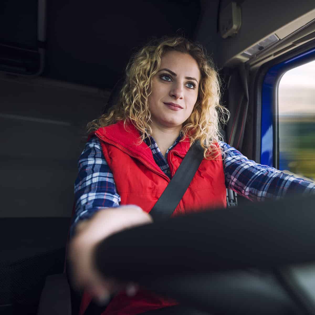 woman driving truck vehicle scaled